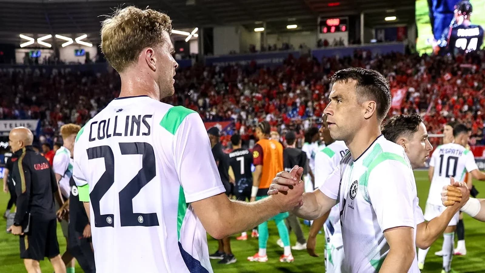 Players shaking hands after a soccer match Players shaking hands after a soccer match