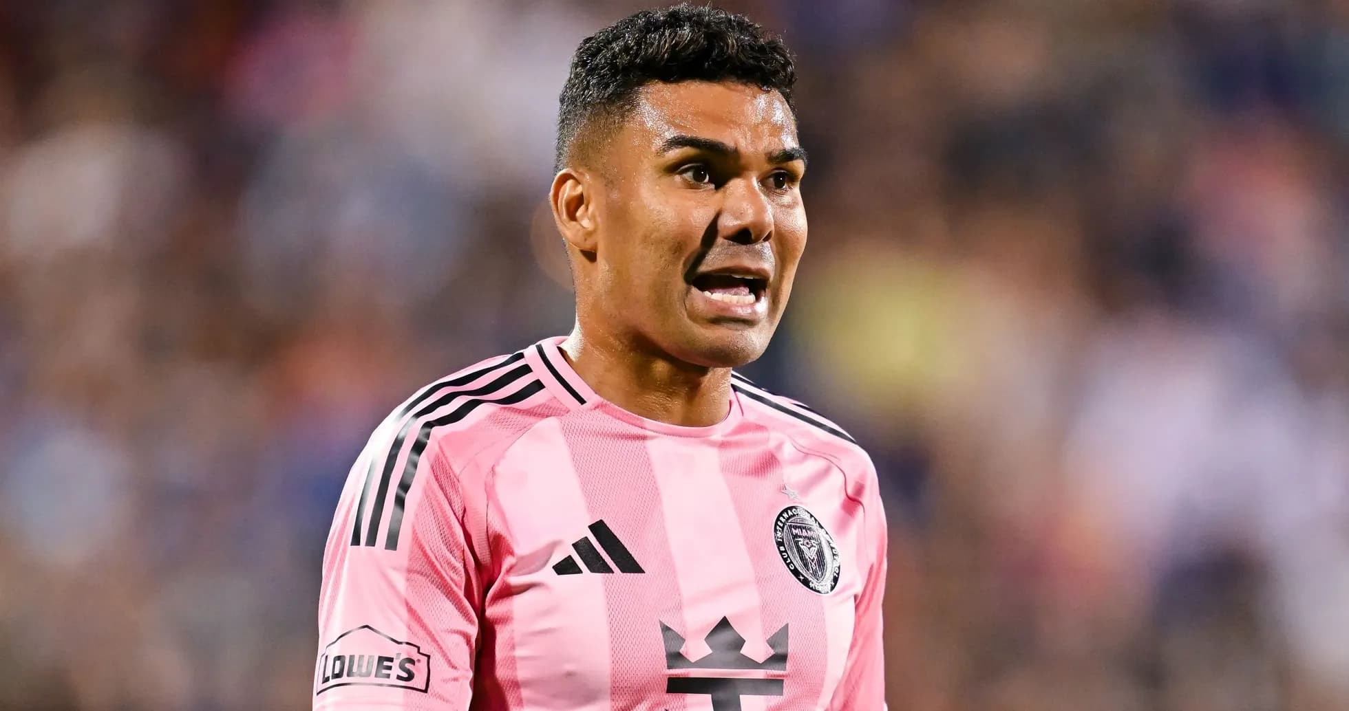 Player in pink jersey shouting during match Player in pink jersey shouting during match