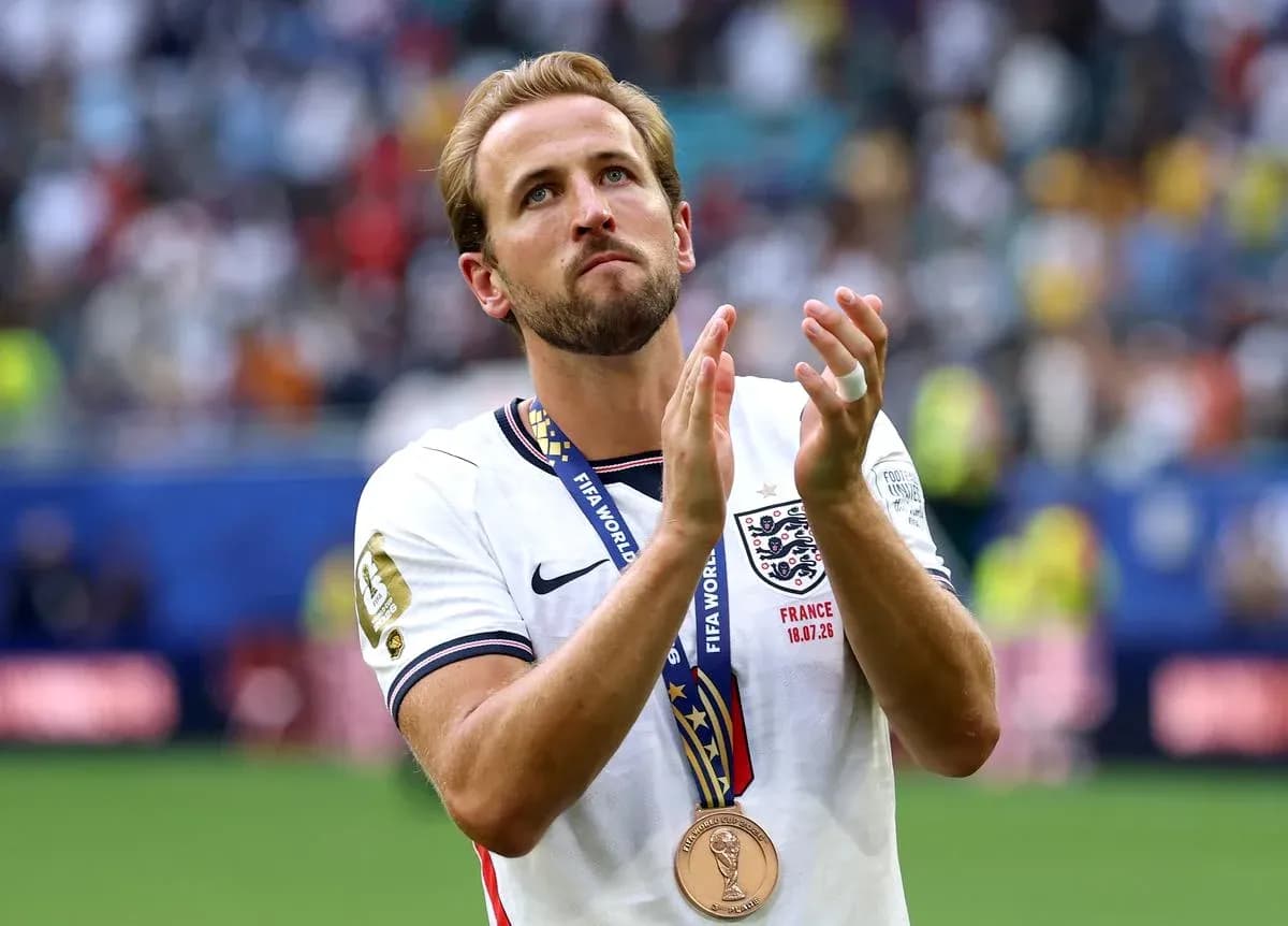 Player with medal applauding after match Player with medal applauding after match