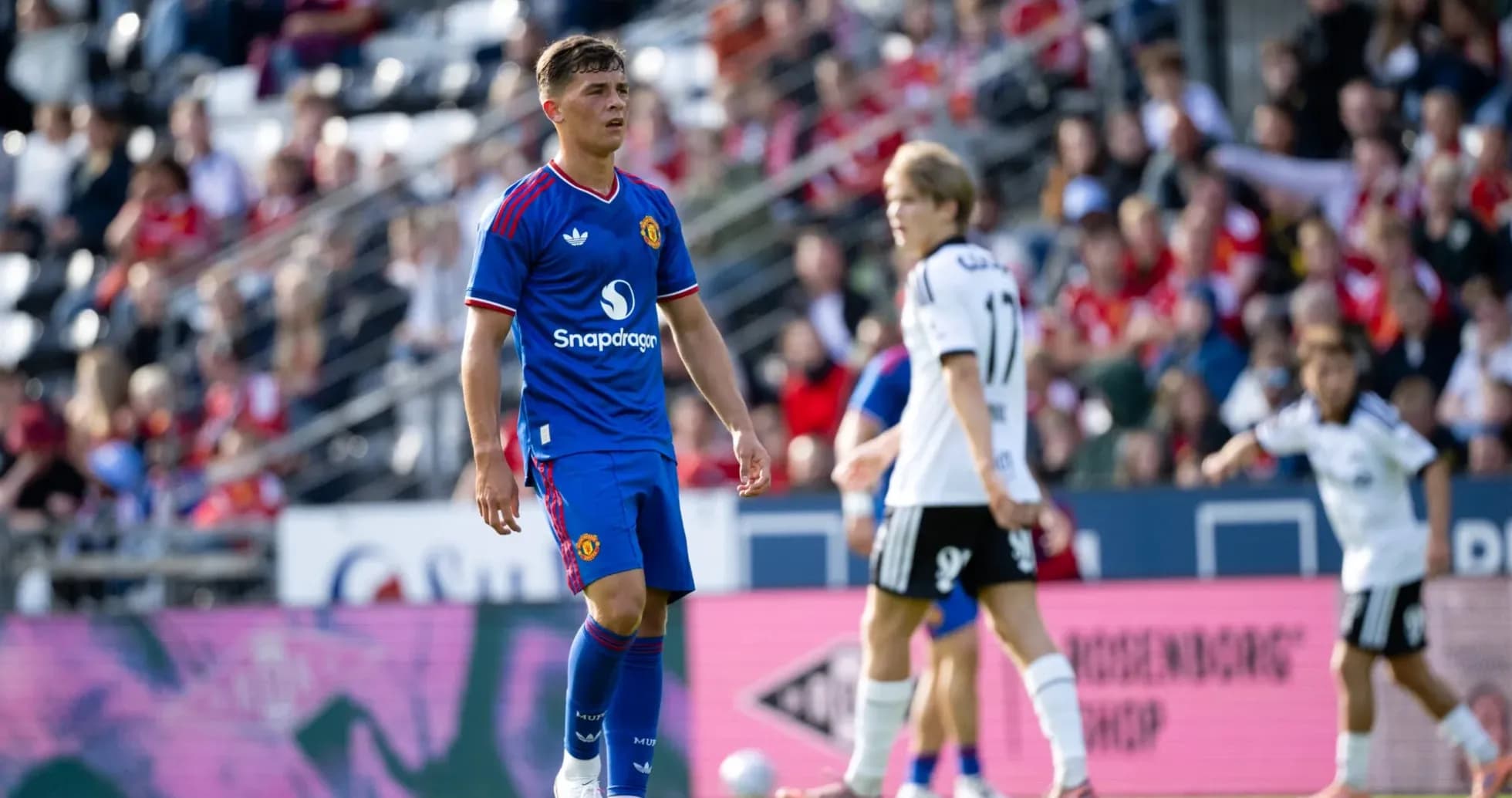Player in blue Manchester United kit during match Player in blue Manchester United kit during match