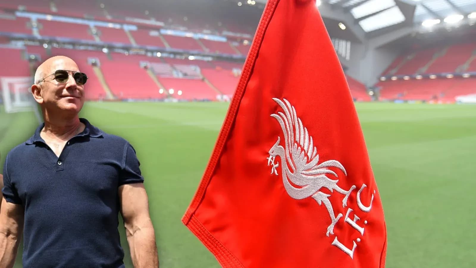 Person standing near Liverpool FC flag at stadium Person standing near Liverpool FC flag at stadium