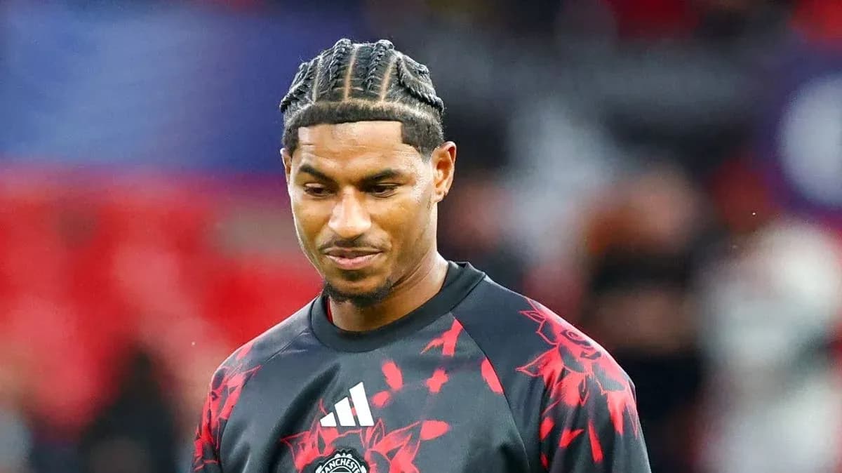 Player wearing Manchester United training kit on pitch Player wearing Manchester United training kit on pitch