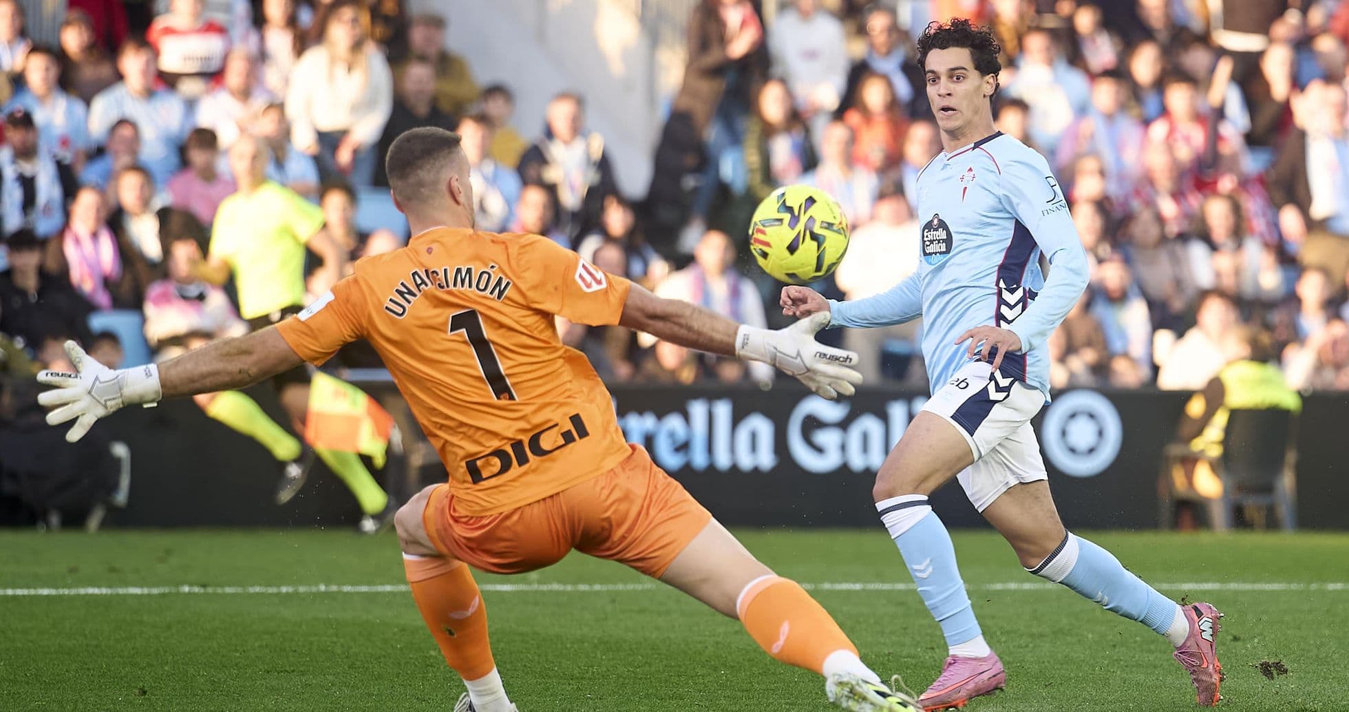 Goalkeeper attempting to save a shot during match Goalkeeper attempting to save a shot during match