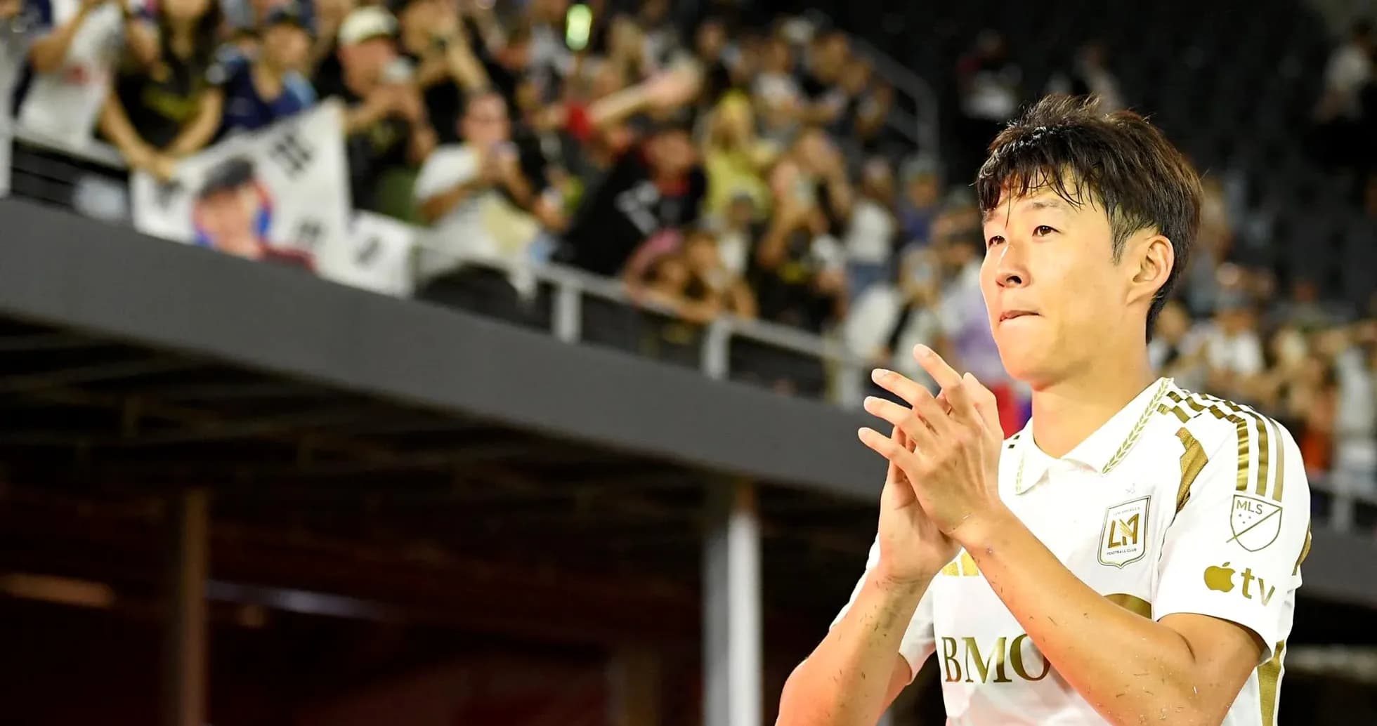 Player applauding fans in stadium during match Player applauding fans in stadium during match