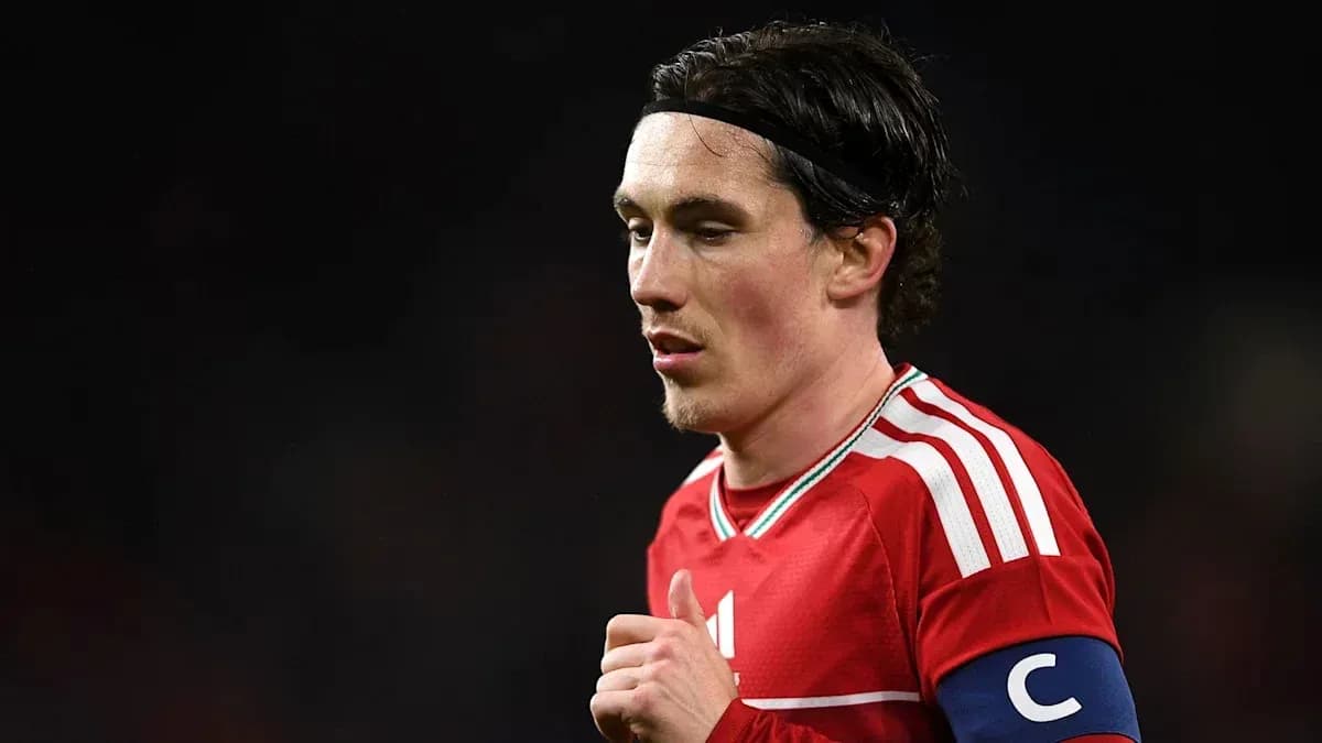 Player wearing red jersey and captain's armband Player wearing red jersey and captain's armband