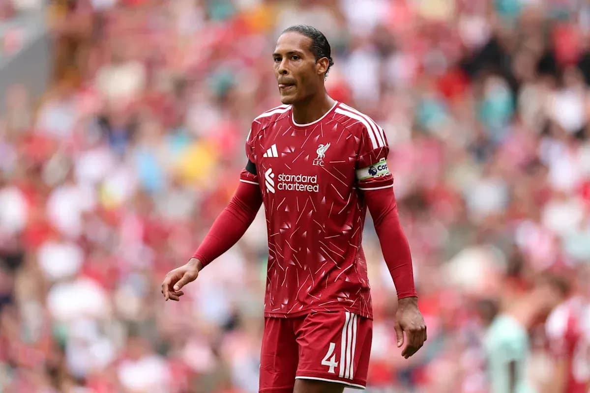 Player in Liverpool kit walking on the pitch Player in Liverpool kit walking on the pitch