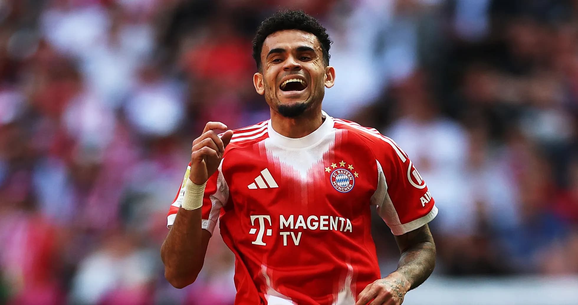 Player celebrating after scoring a goal for Bayern Munich Player celebrating after scoring a goal for Bayern Munich