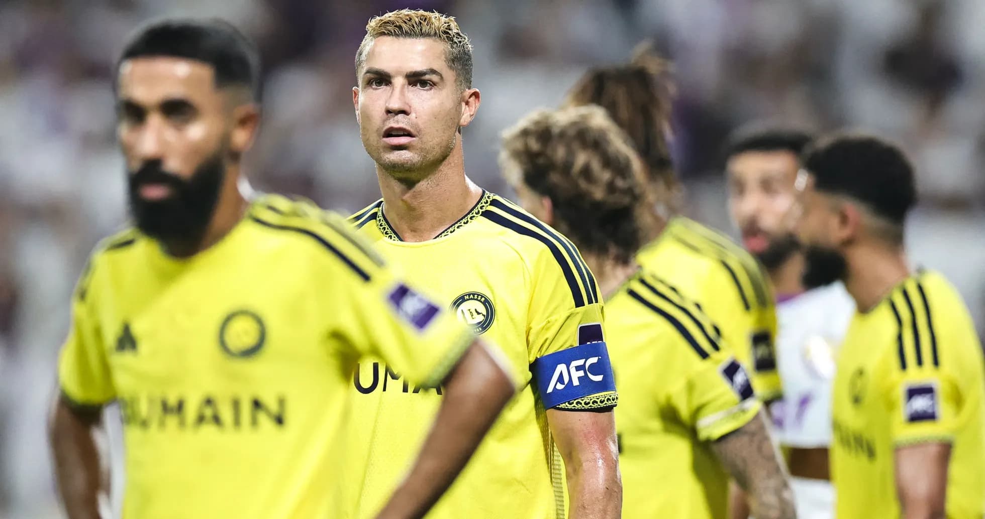 Cristiano Ronaldo with teammates in yellow jerseys Cristiano Ronaldo with teammates in yellow jerseys