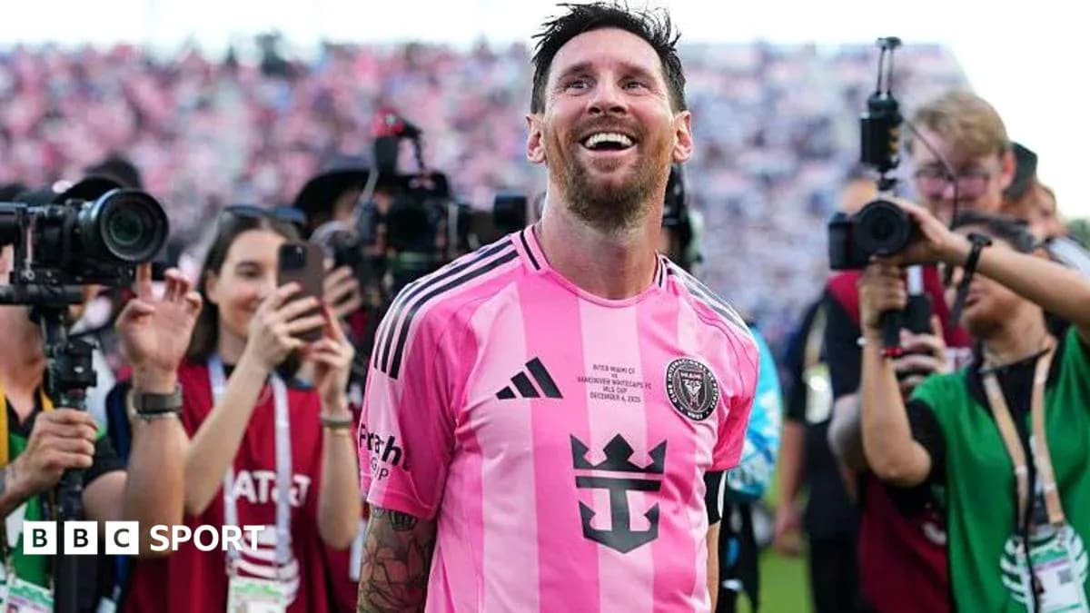 Player celebrating amidst photographers after match Player celebrating amidst photographers after match