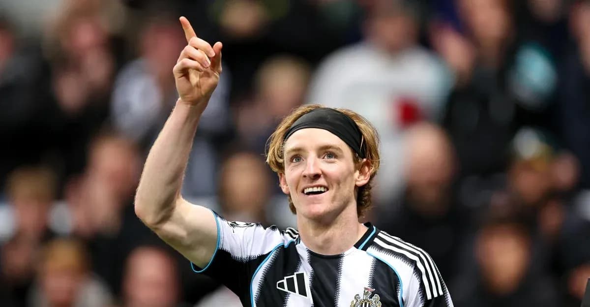 Newcastle player celebrating goal with raised finger Newcastle player celebrating goal with raised finger