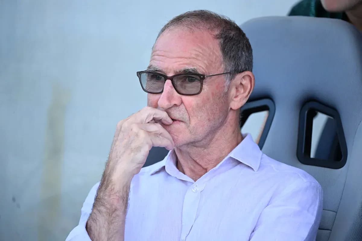 Man seated, wearing glasses, deep in thought Man seated, wearing glasses, deep in thought