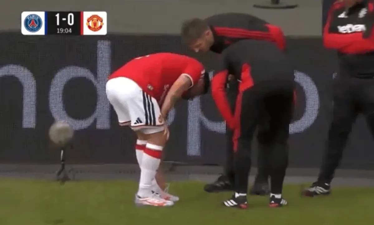 Player receiving medical attention on the sideline Player receiving medical attention on the sideline