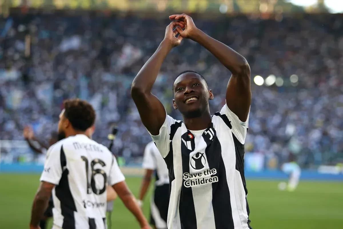 Player celebrating with teammates after match victory Player celebrating with teammates after match victory