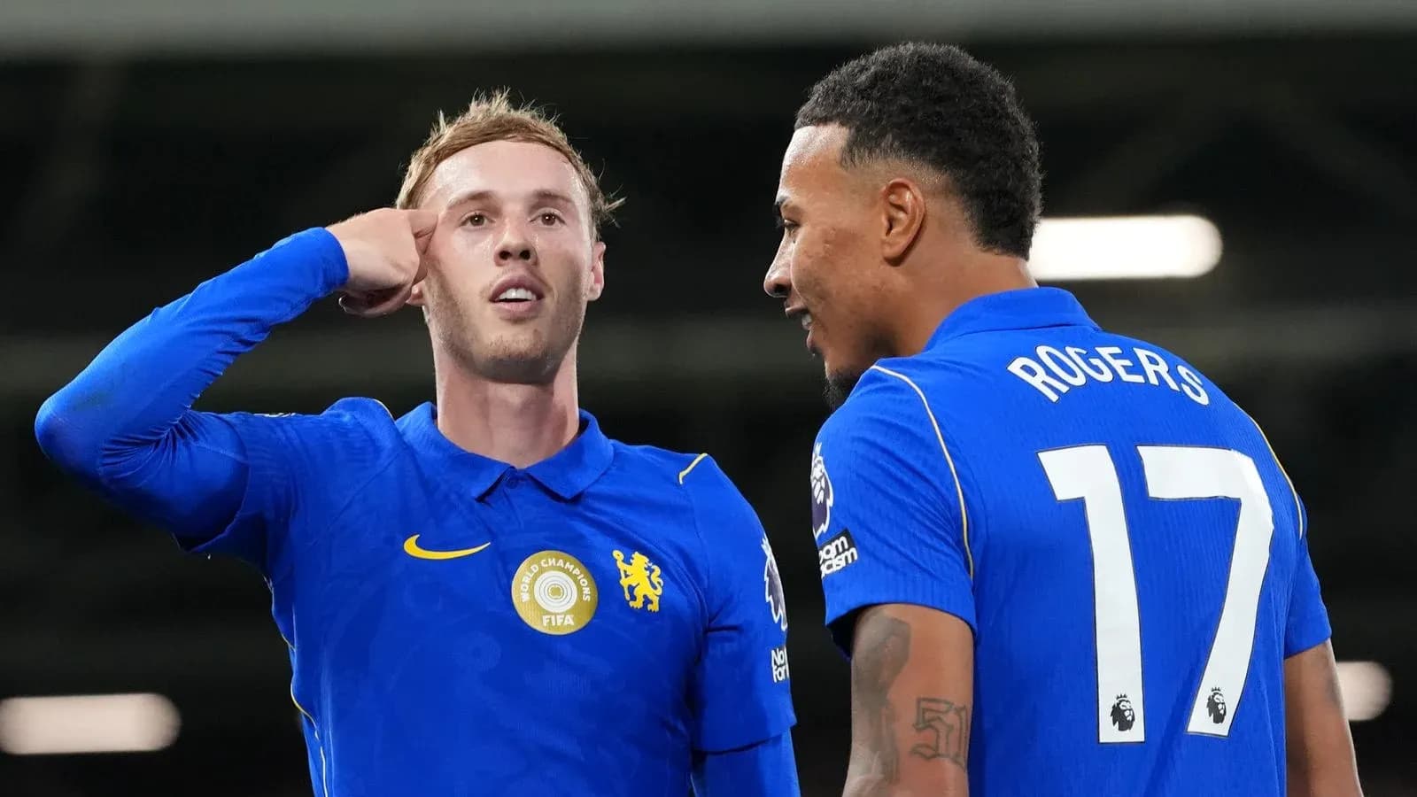 Two football players celebrating on the pitch Two football players celebrating on the pitch