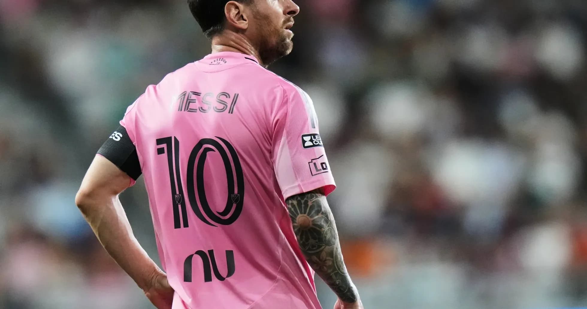 Player in pink jersey with 'Messi' and number 10 Player in pink jersey with 'Messi' and number 10