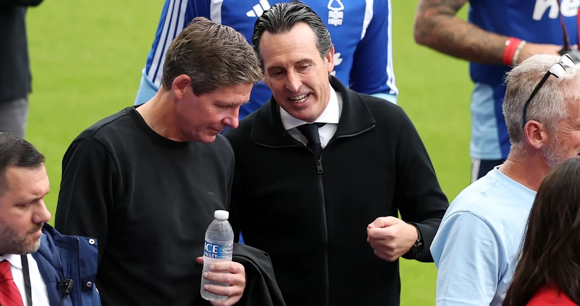 Two men talking on the pitch during match Two men talking on the pitch during match