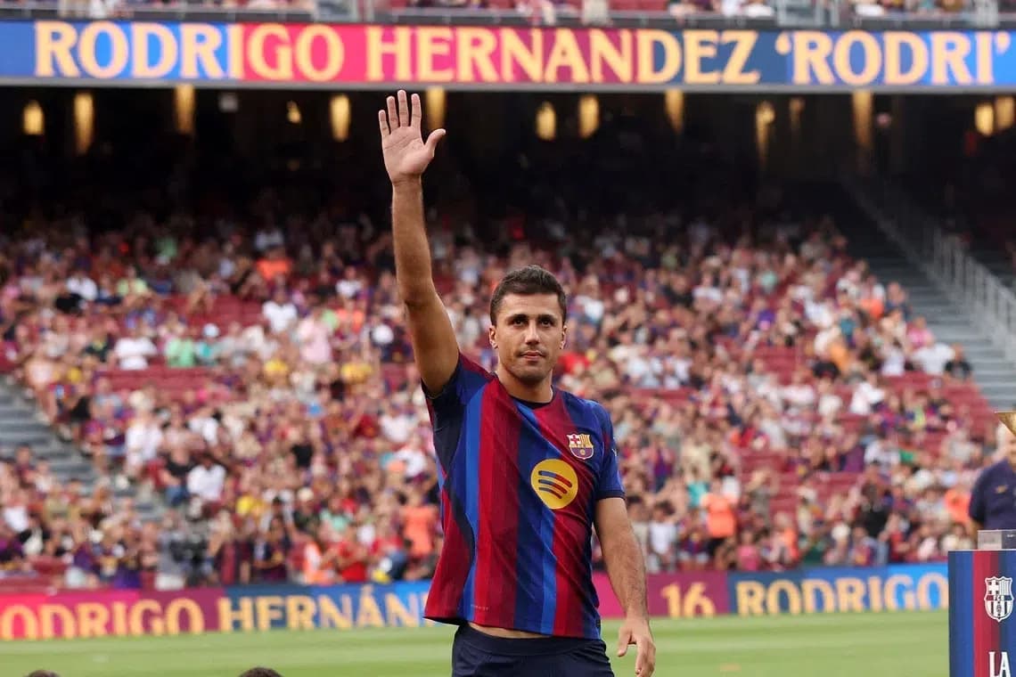 Player waving to fans at stadium event Player waving to fans at stadium event