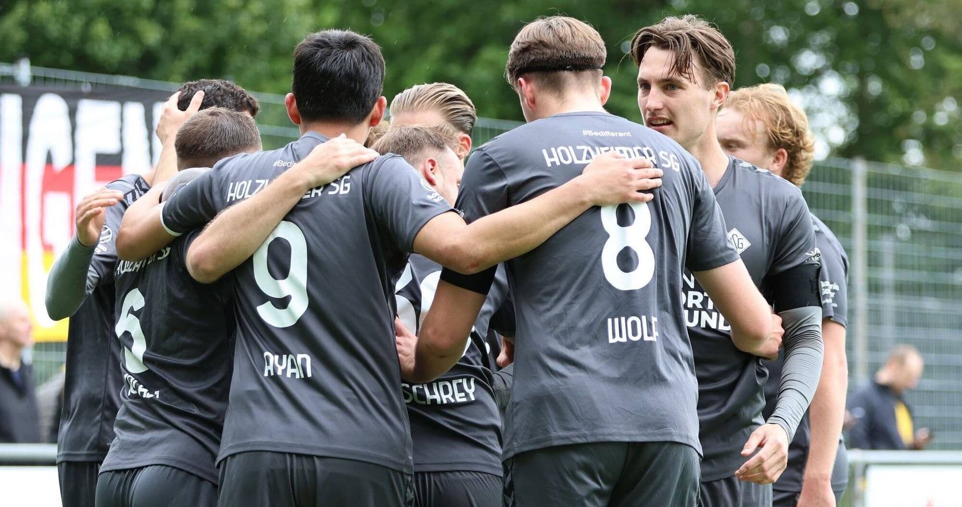 Holzheimer SG players celebrating a goal together Holzheimer SG players celebrating a goal together