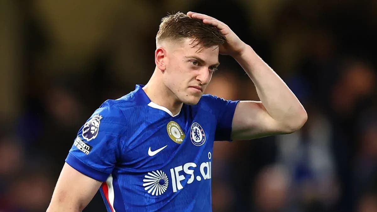 Player in blue jersey looking frustrated on pitch Player in blue jersey looking frustrated on pitch