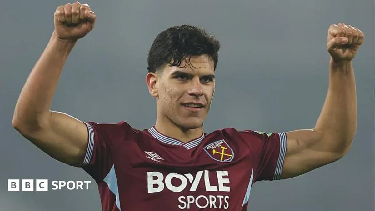 Player celebrating victory in West Ham jersey Player celebrating victory in West Ham jersey