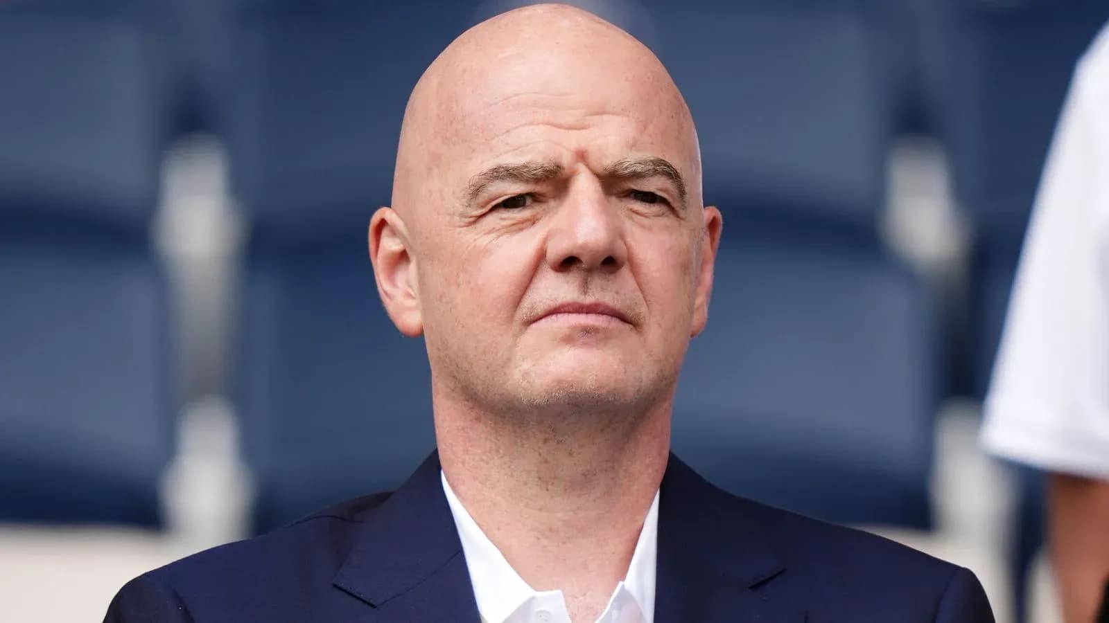 FIFA president seated at an event FIFA president seated at an event