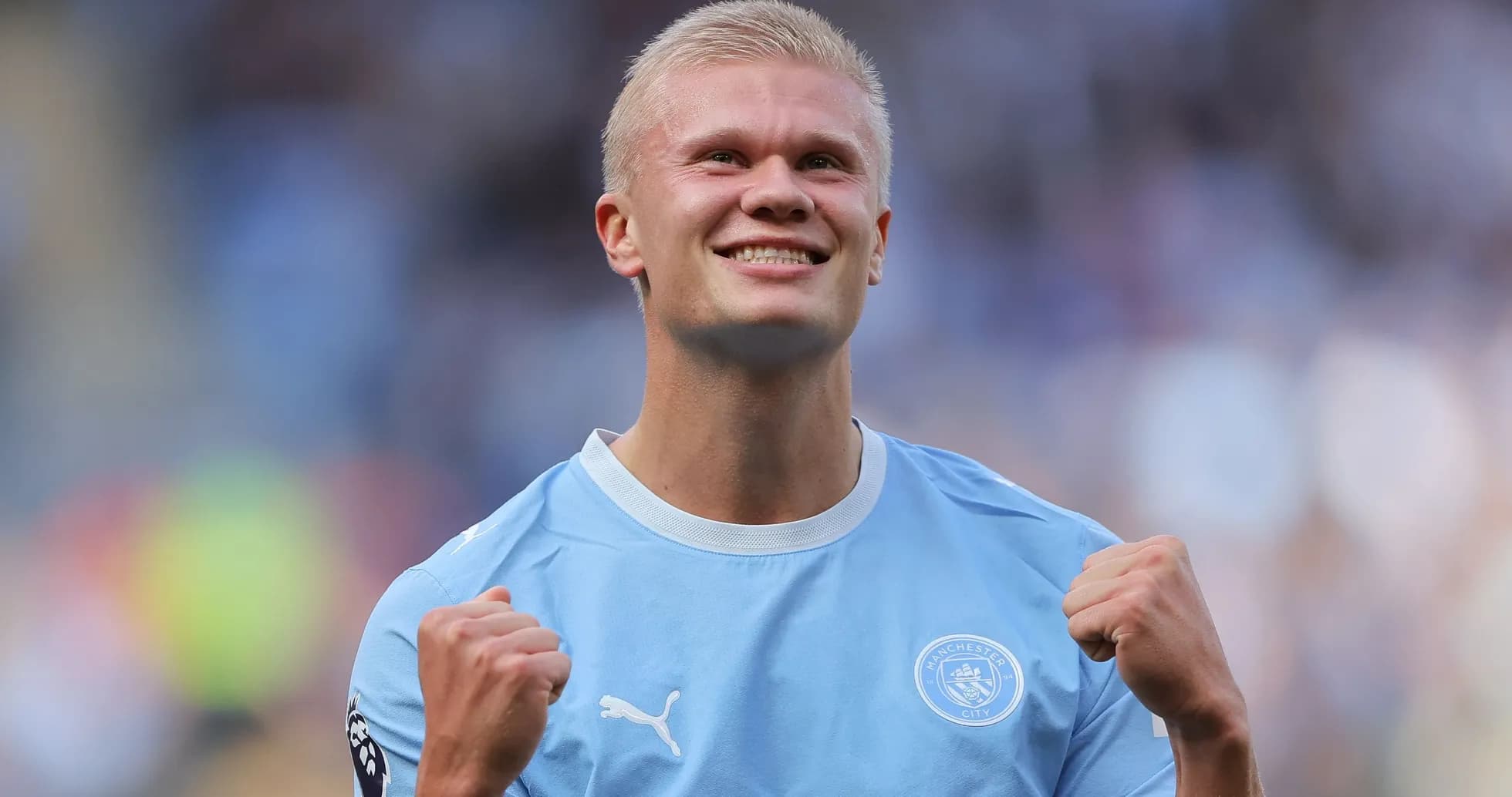 Player celebrating after scoring a goal for Manchester City Player celebrating after scoring a goal for Manchester City