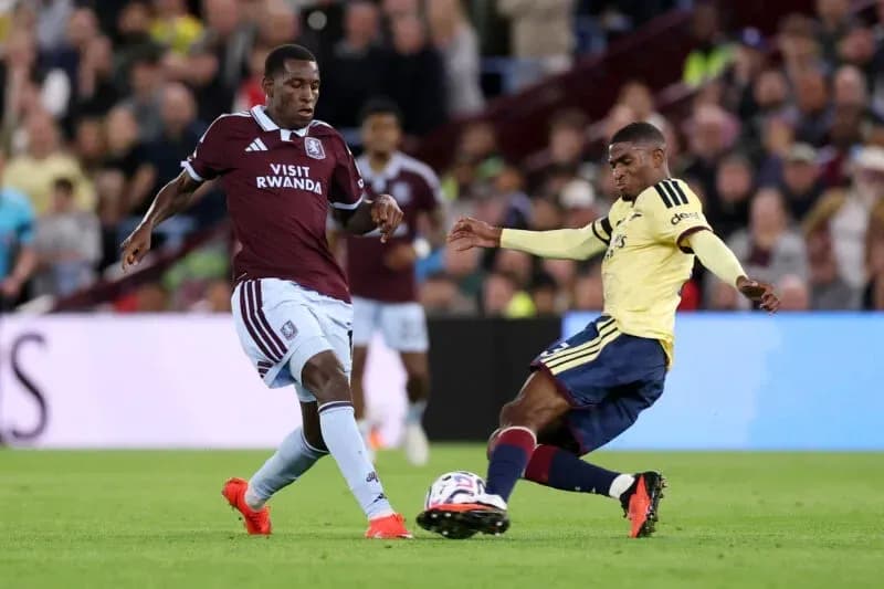Two players contesting the ball during match Two players contesting the ball during match