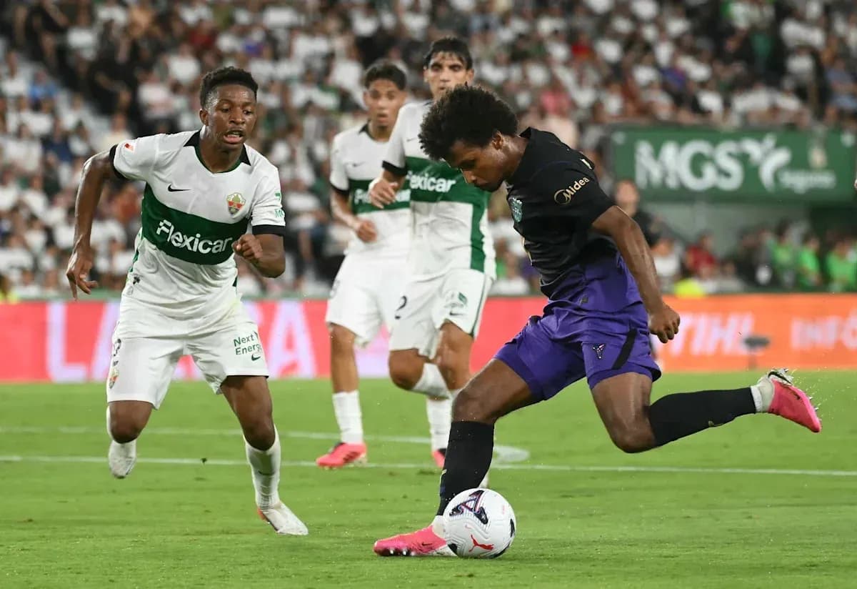 Player dribbling the ball during a soccer match Player dribbling the ball during a soccer match