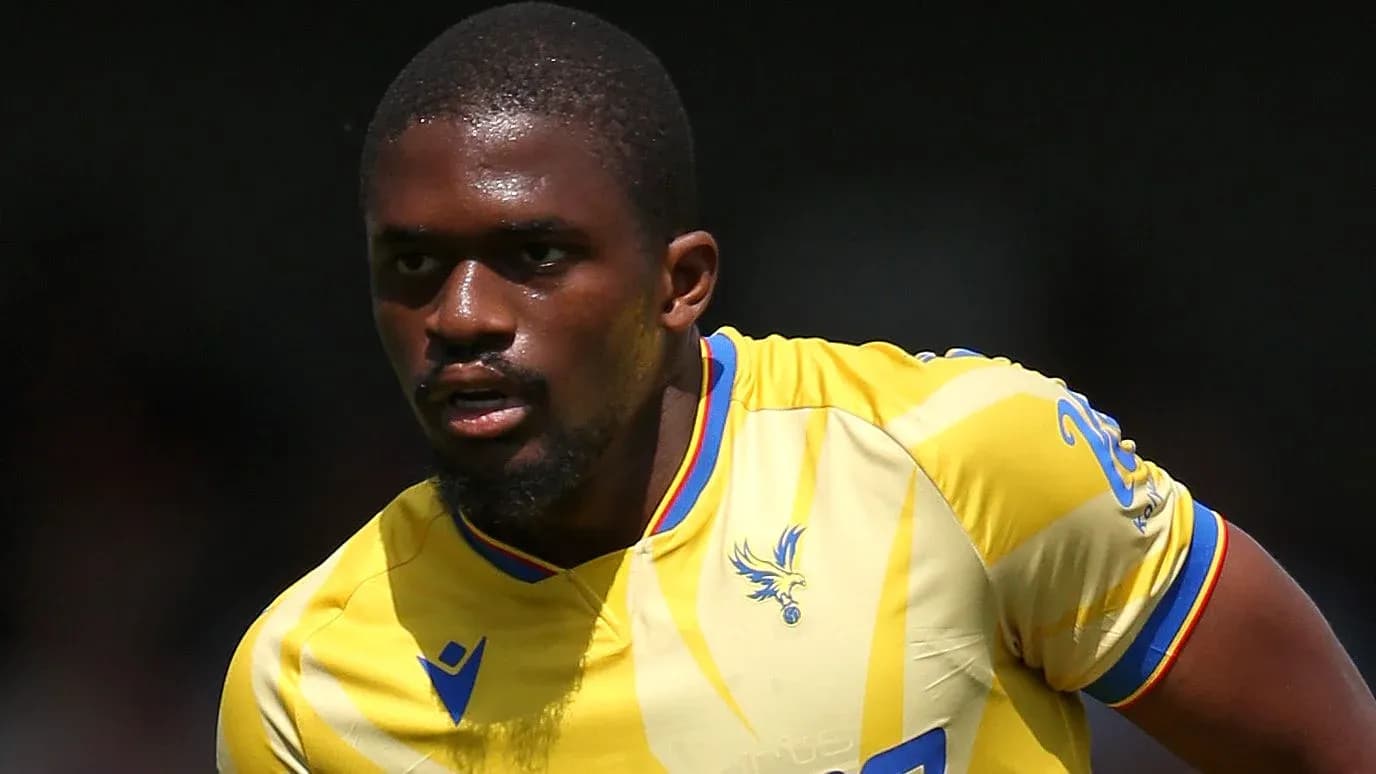 Player in yellow jersey running during match Player in yellow jersey running during match