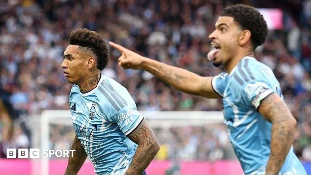 Two players celebrating a goal on the field Two players celebrating a goal on the field