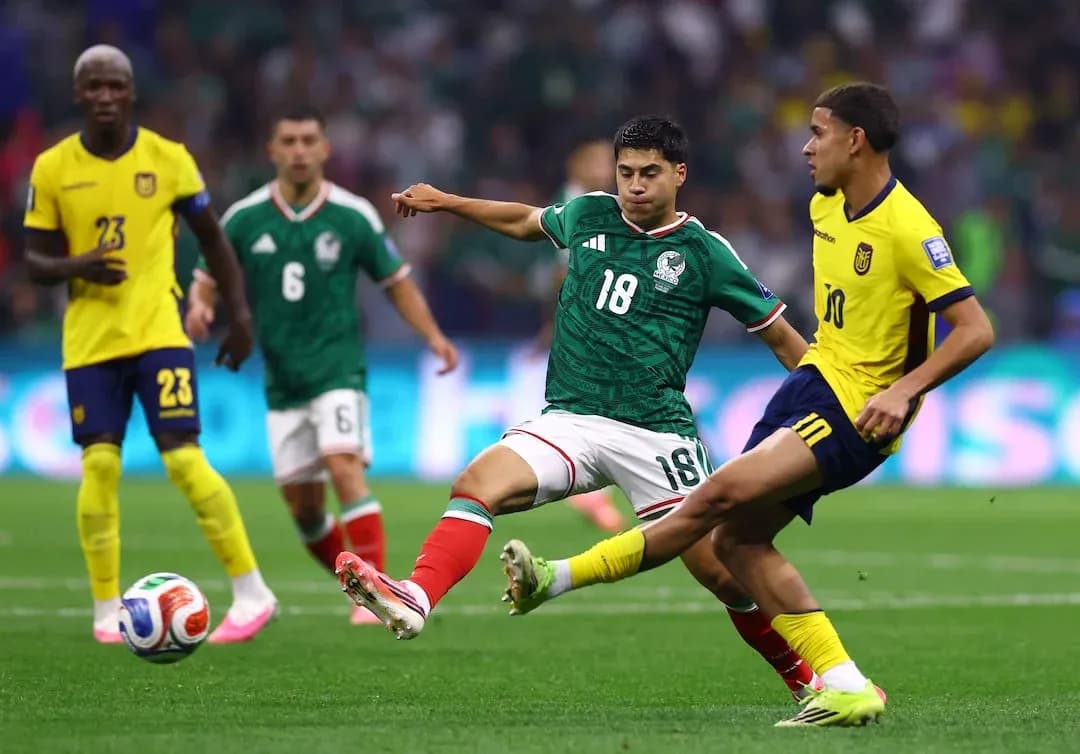 Mexico and Ecuador players competing for the ball Mexico and Ecuador players competing for the ball