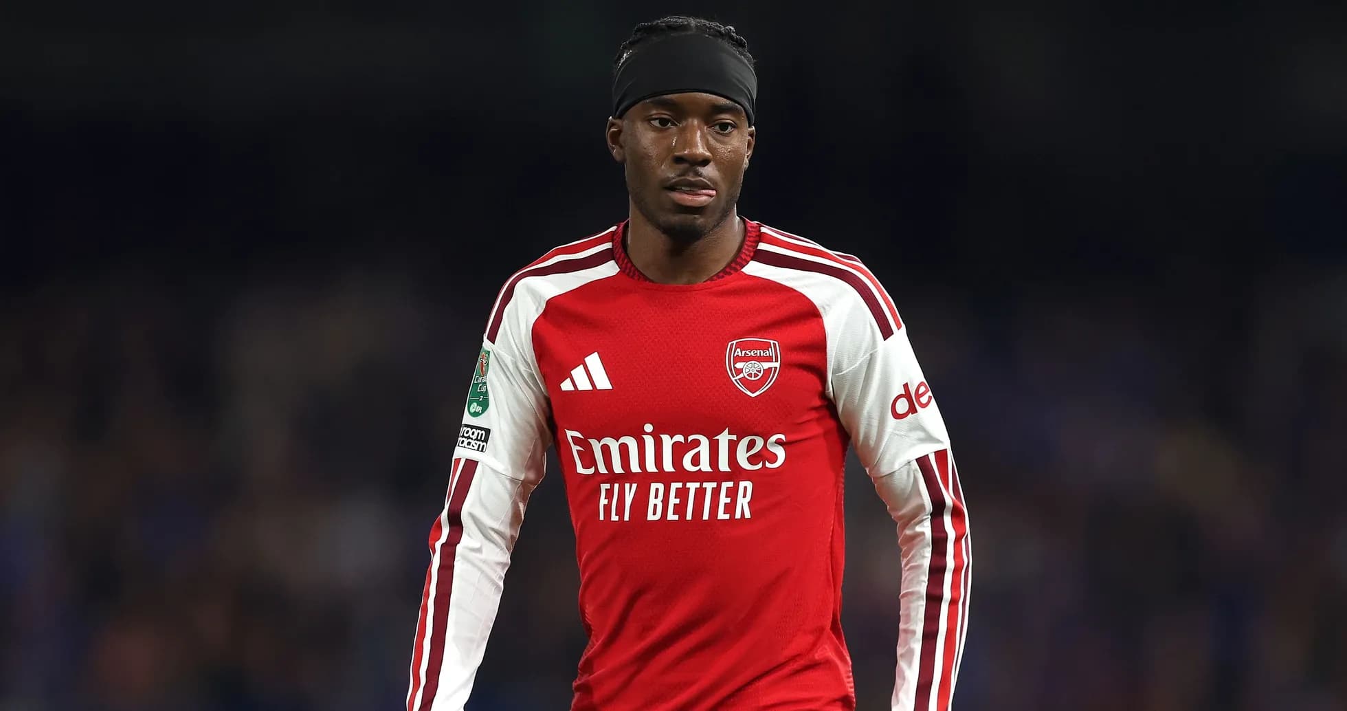 Player wearing Arsenal jersey during a match Player wearing Arsenal jersey during a match