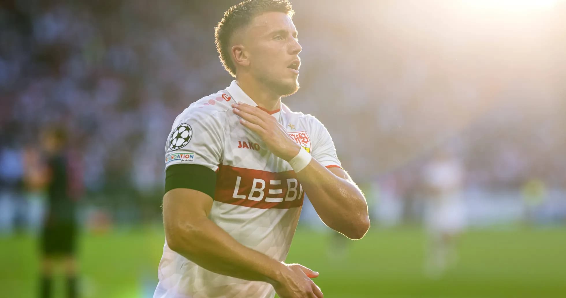 Player celebrating with hand on chest during match Player celebrating with hand on chest during match