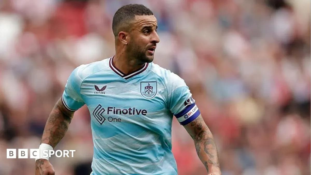 Player in light blue jersey running on the pitch Player in light blue jersey running on the pitch