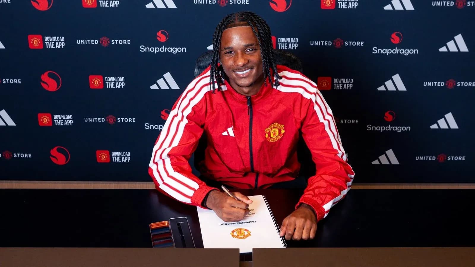 Player signing contract at Manchester United press event Player signing contract at Manchester United press event