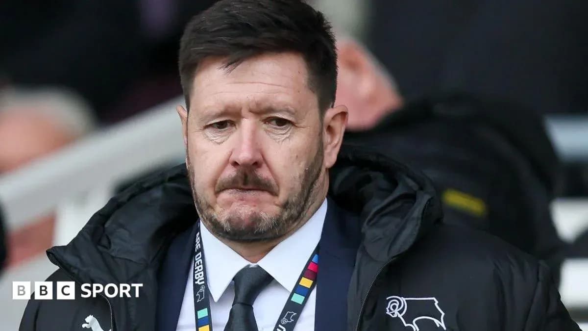Manager looking on during match from sidelines Manager looking on during match from sidelines