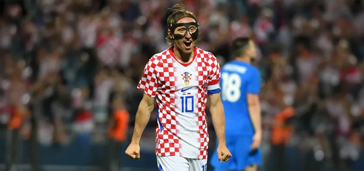 Croatian player celebrating with fans after scoring Croatian player celebrating with fans after scoring