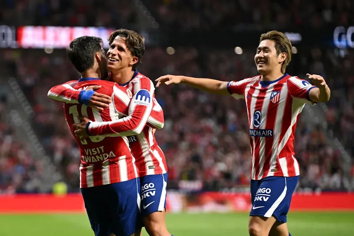 Atletico Madrid players celebrating a goal together Atletico Madrid players celebrating a goal together