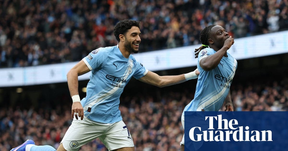 Manchester City players celebrating a goal together Manchester City players celebrating a goal together