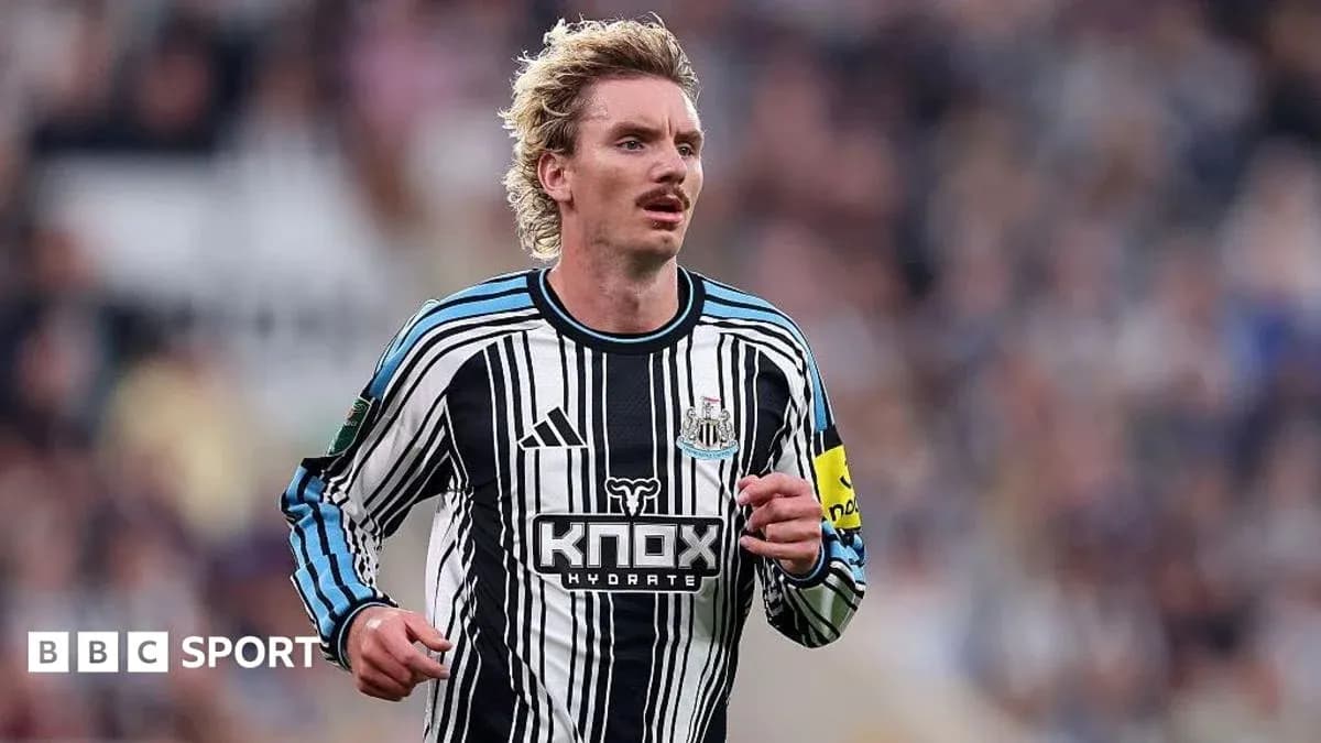 Player running in Newcastle United home kit during match Player running in Newcastle United home kit during match