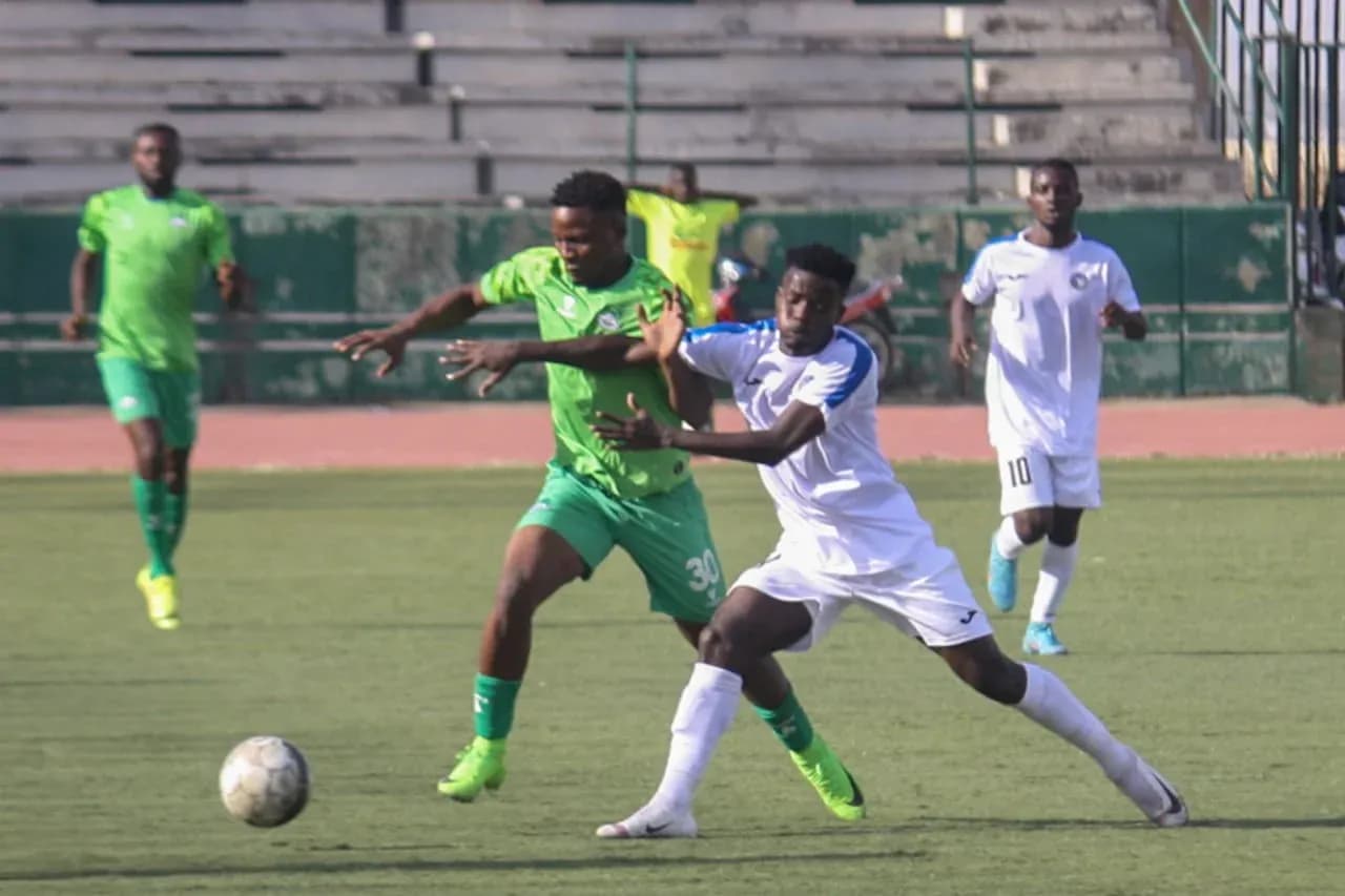 Nasarawa United player tackling Enyimba player Nasarawa United player tackling Enyimba player