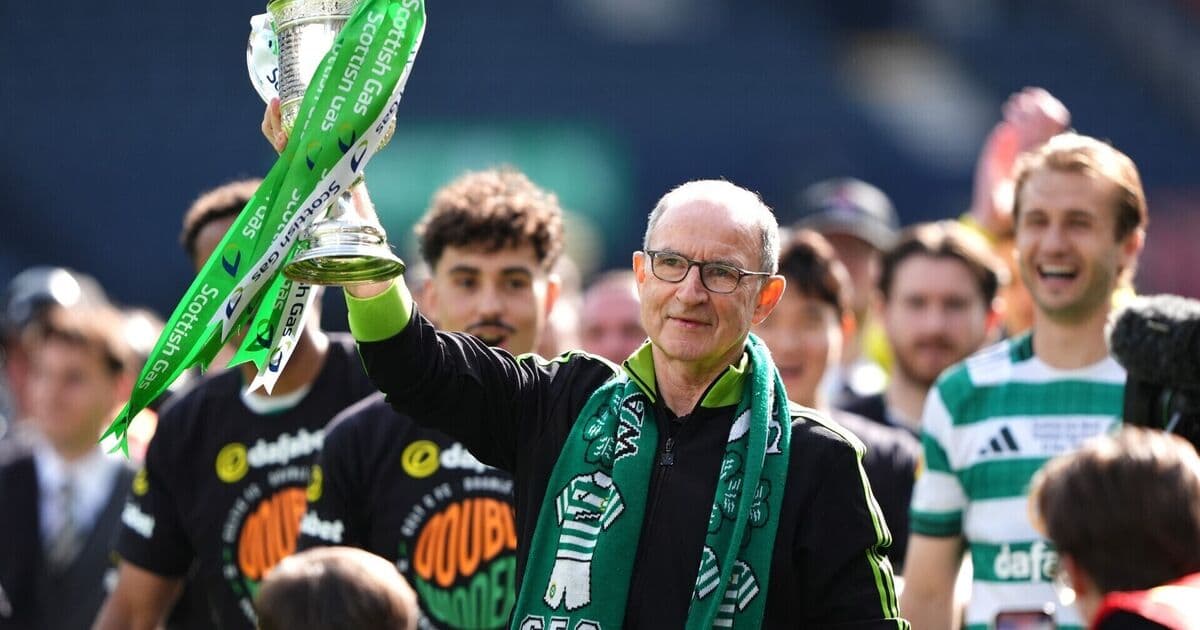 Coach celebrating with trophy and team members Coach celebrating with trophy and team members