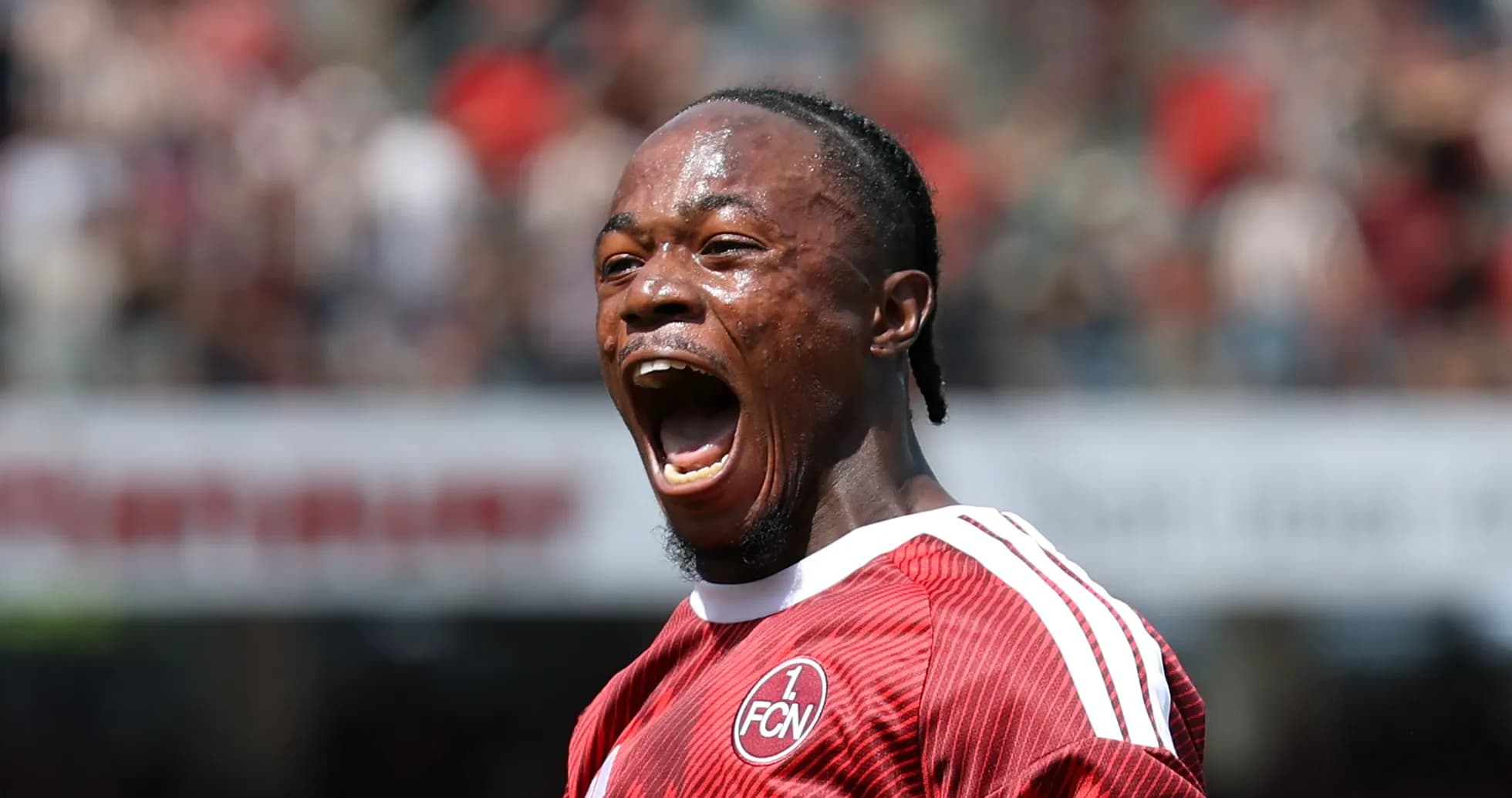 Player celebrating passionately on the field Player celebrating passionately on the field