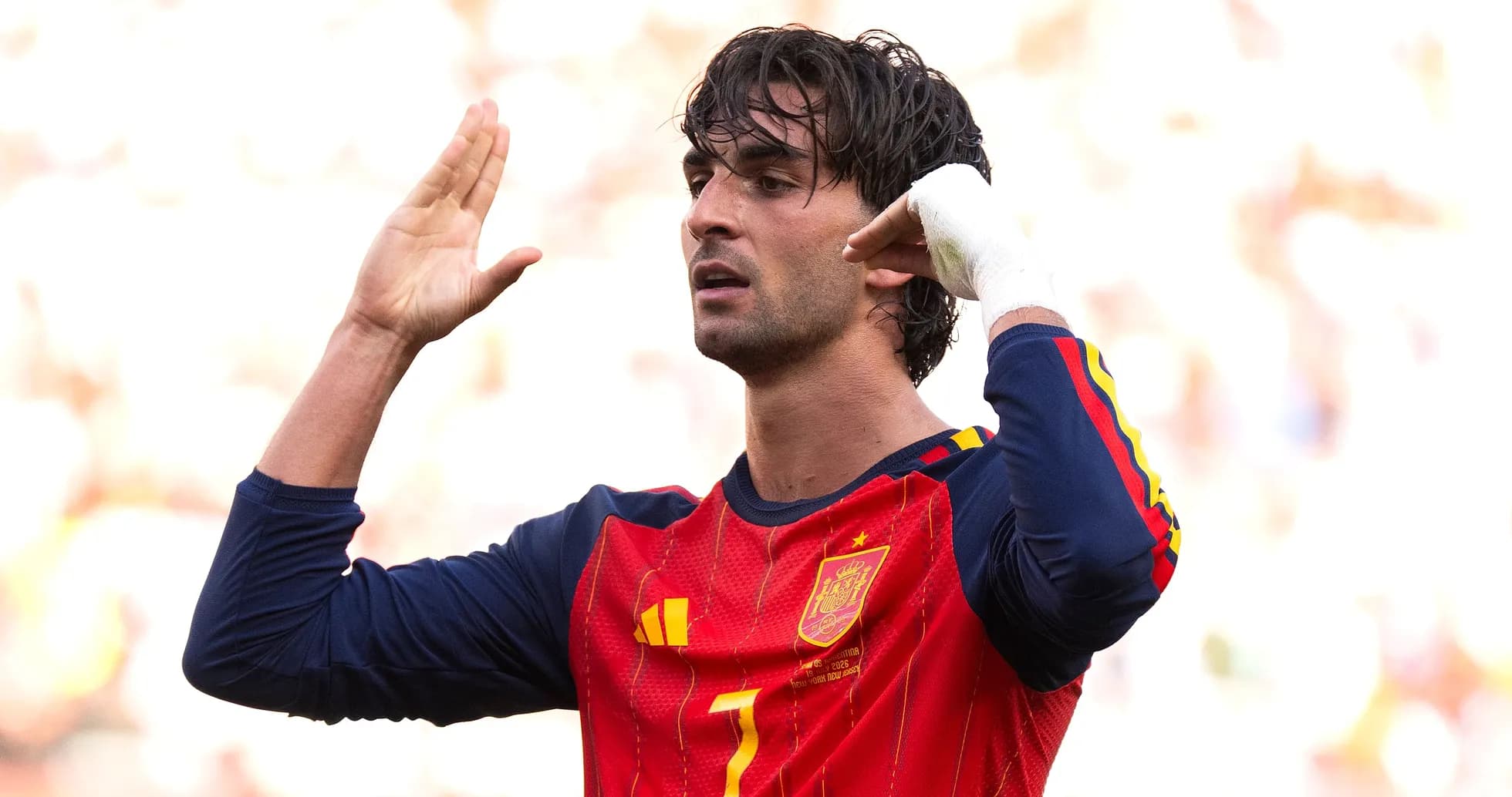 Player gesturing during a football match Player gesturing during a football match