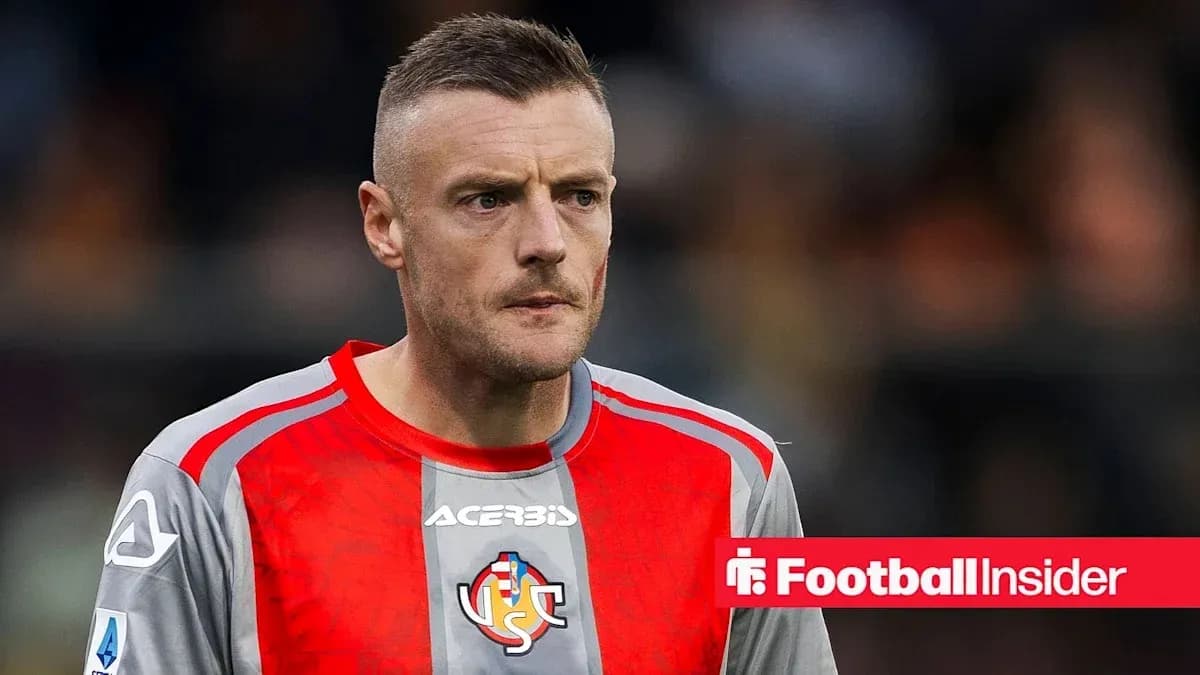 Goalkeeper in grey and red kit during match Goalkeeper in grey and red kit during match