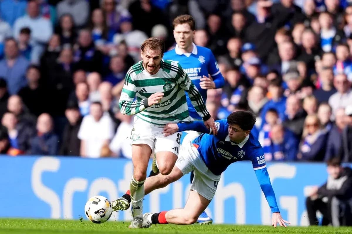 Celtic player evading a tackle from Rangers player Celtic player evading a tackle from Rangers player