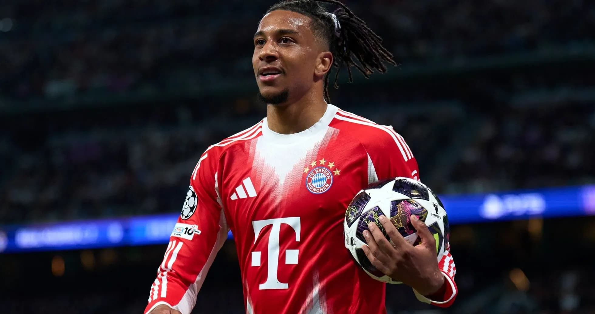 Bayern Munich player holding Champions League ball Bayern Munich player holding Champions League ball