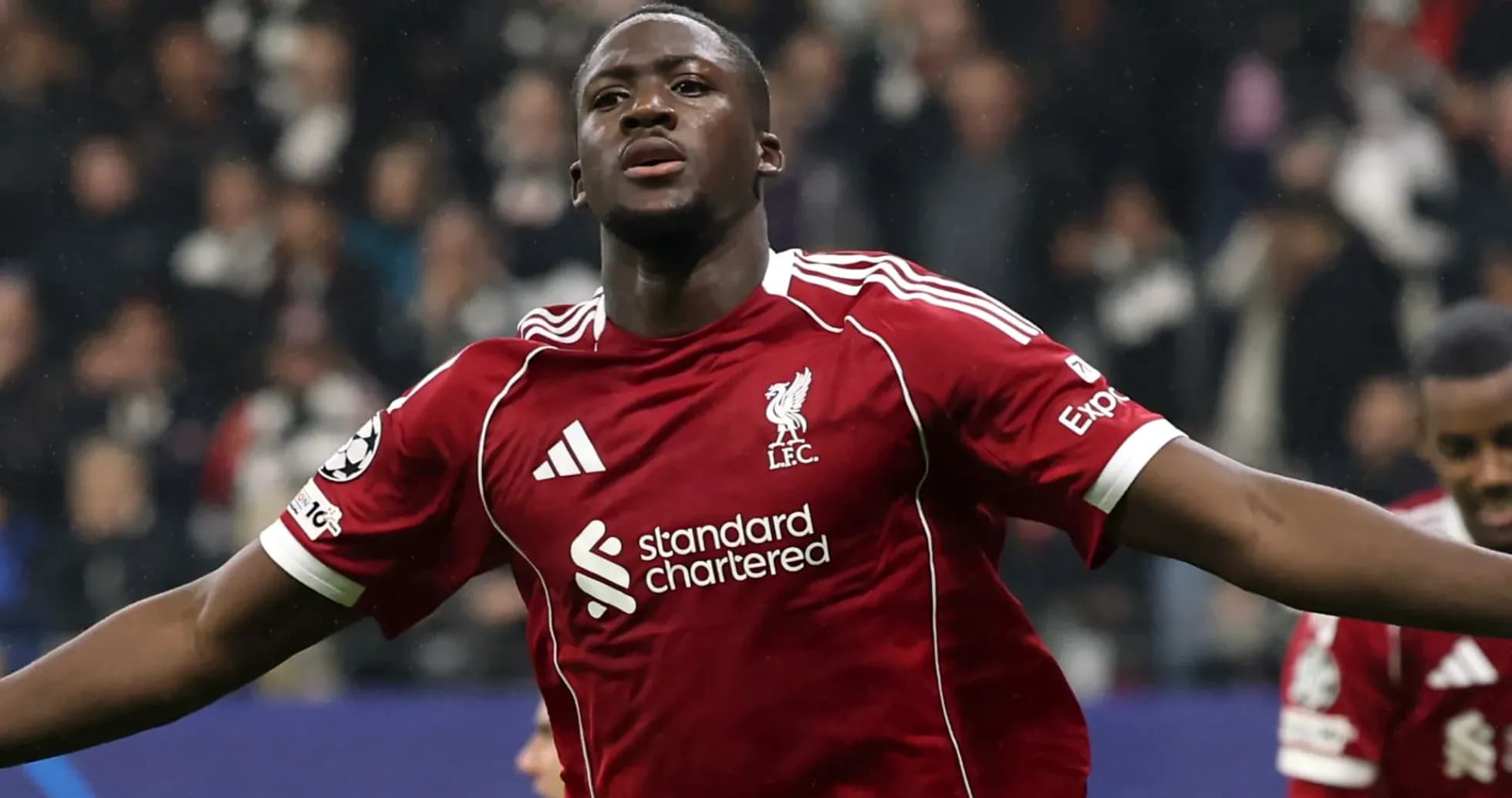 Player celebrating a goal in Liverpool kit Player celebrating a goal in Liverpool kit