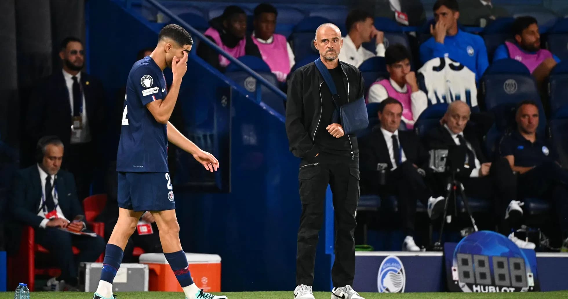 Player leaving the field while coach observes Player leaving the field while coach observes