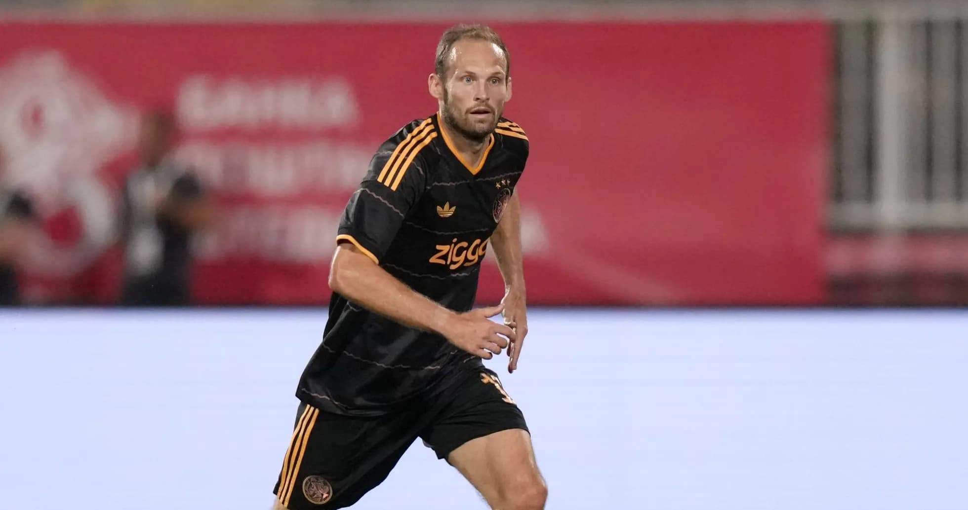 Player in black jersey running during match Player in black jersey running during match